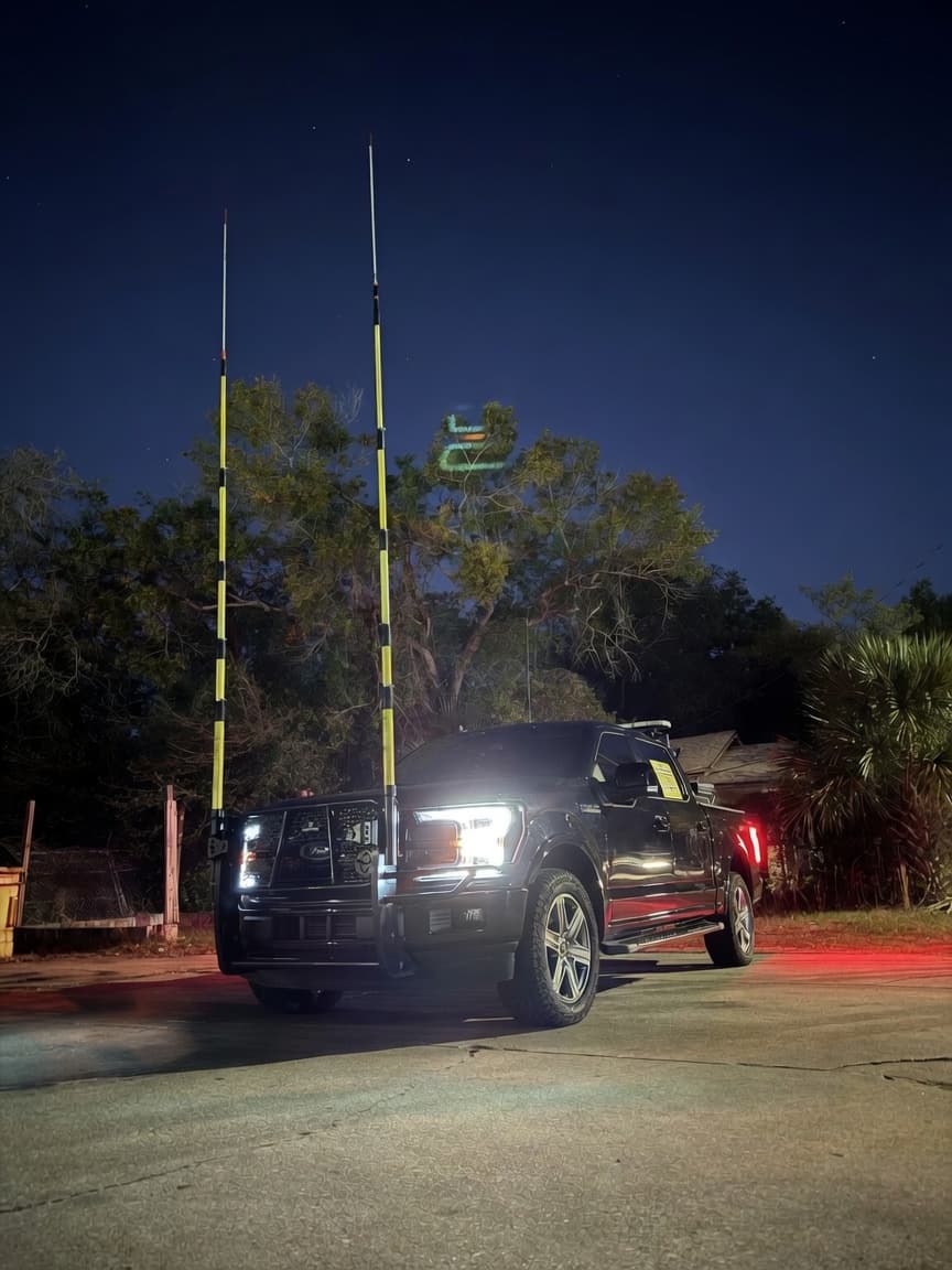 High-pole pilot vehicle prepared for oversize-load clearance support at night